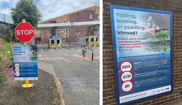 A blue poster with visible text reading 'Fishing, boating or paddling abroad' is attached to a stop sign in front of a UK border checkpoint 